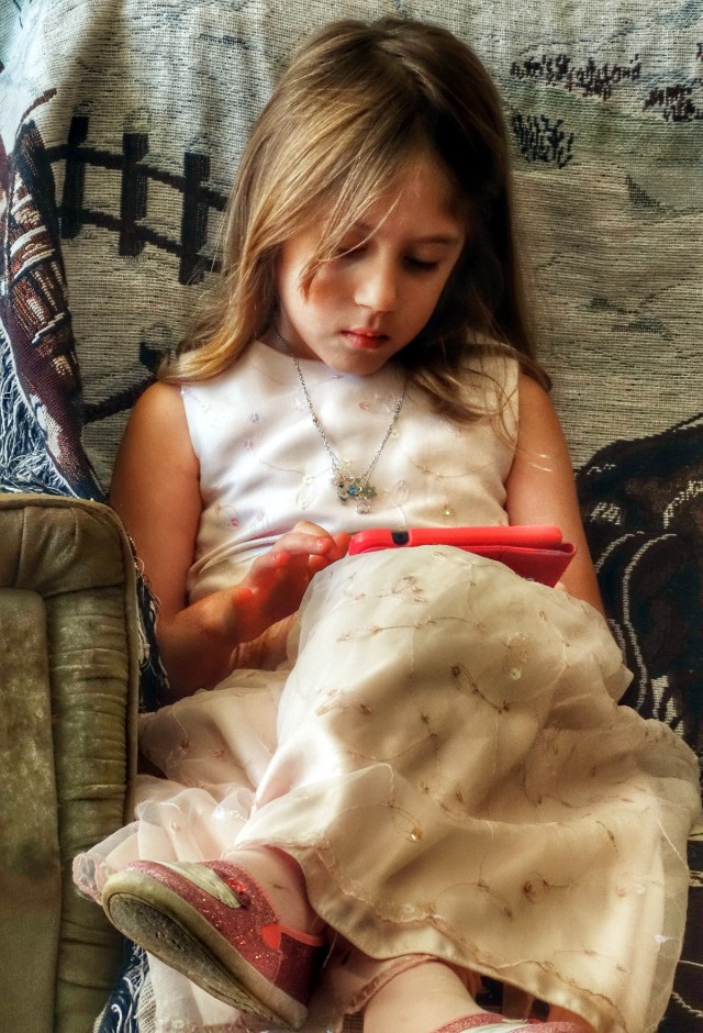 Young_Girl_Using_Mobile_Device_mobile